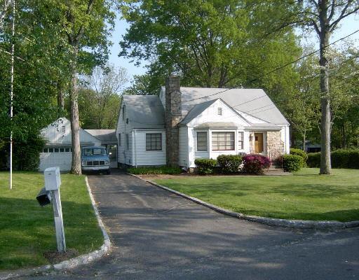 289 Davis Road Fairfield, CT 06825 - Photo 1 of 1 a front view of a house with a yard
