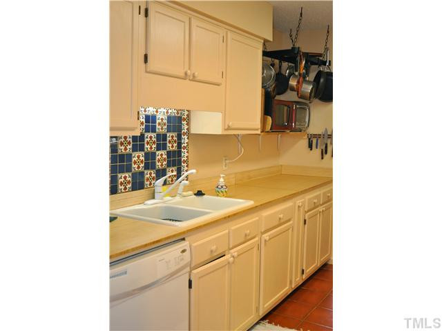 111 Shady Spring Place Durham, NC 27713 - Photo 8 of 23 Unique, hand-made backsplash, bamboo counters, and terracotta tile make this kitchen an inspiring place to work. Kitchen