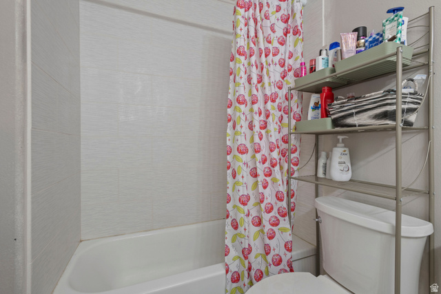 962 Independence Avenue Provo, UT 84604 - Photo 17 of 31 Bathroom featuring shower / tub combo and toilet