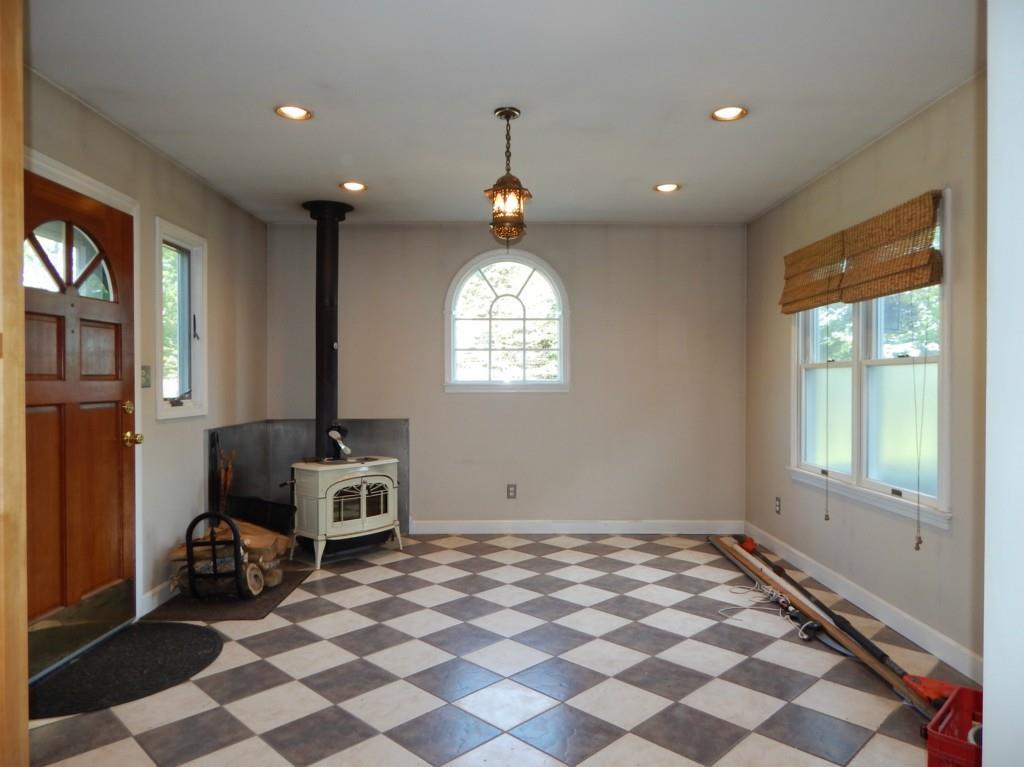 22 Hardy Point Road Pembroke, ME 04666 - Photo 12 of 30 New addition with wood stove off kitchen
