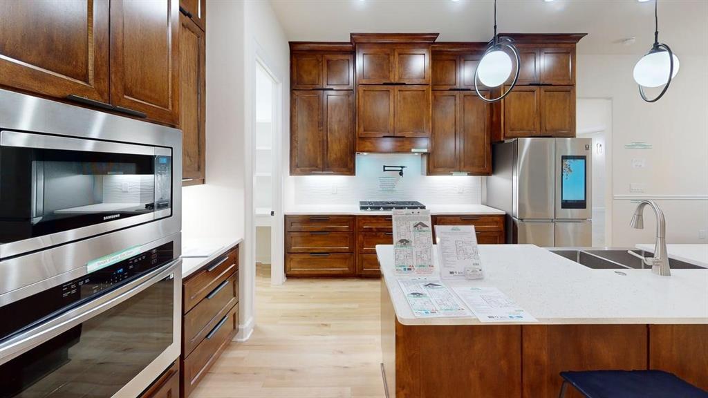 2509 Windmill Lane Longview, TX 75601 - Photo 34 of 35 a kitchen with kitchen island granite countertop a sink and refrigerator
