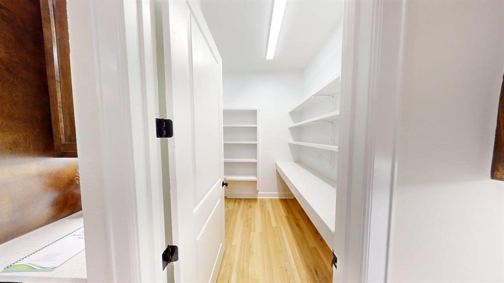 2509 Windmill Lane Longview, TX 75601 - Photo 4 of 35 a view of a hallway with wooden floor and staircase