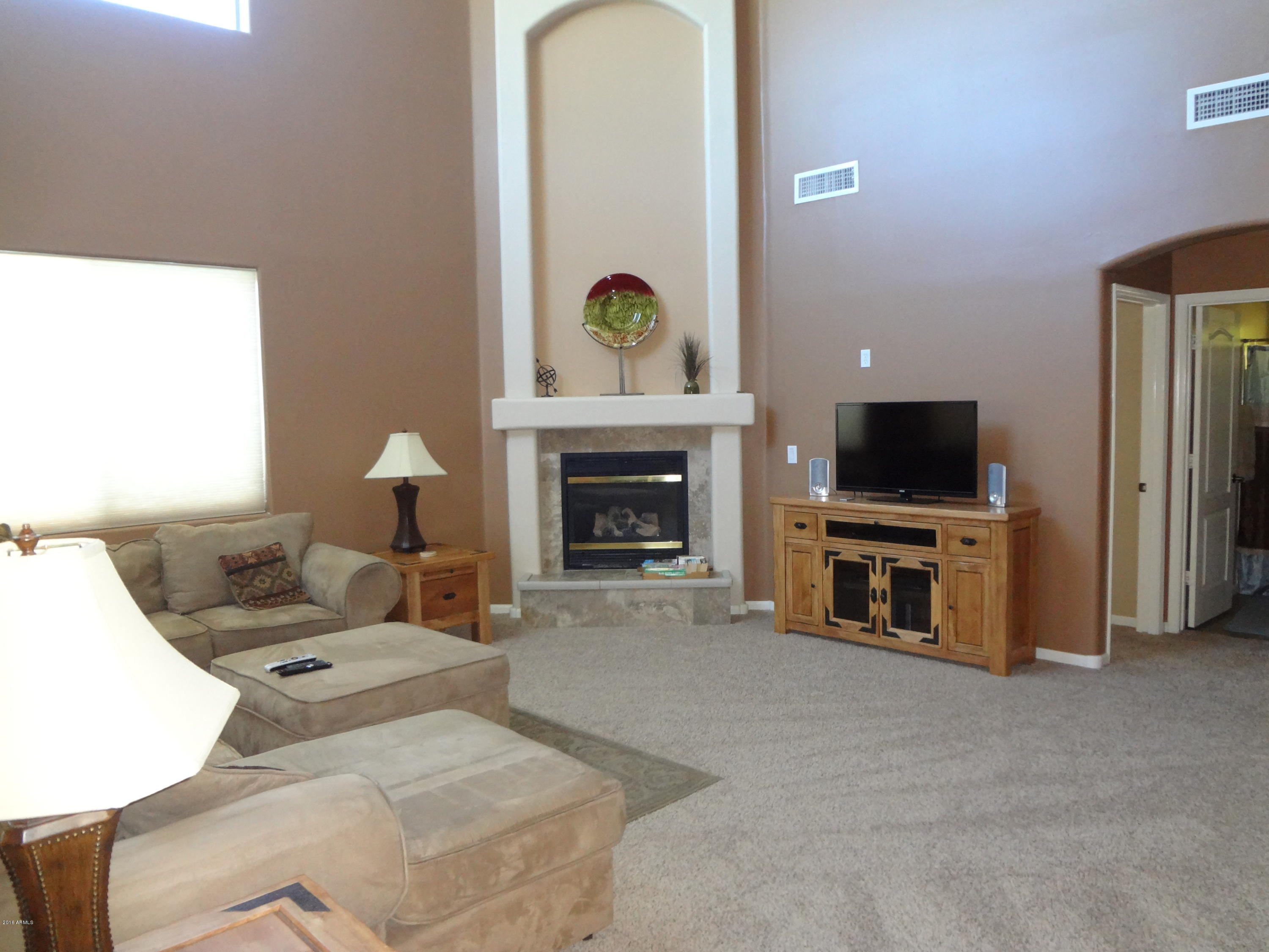 2222 West Roy Rogers Road Phoenix, AZ 85085 - Photo 4 of 37 family room with fireplace