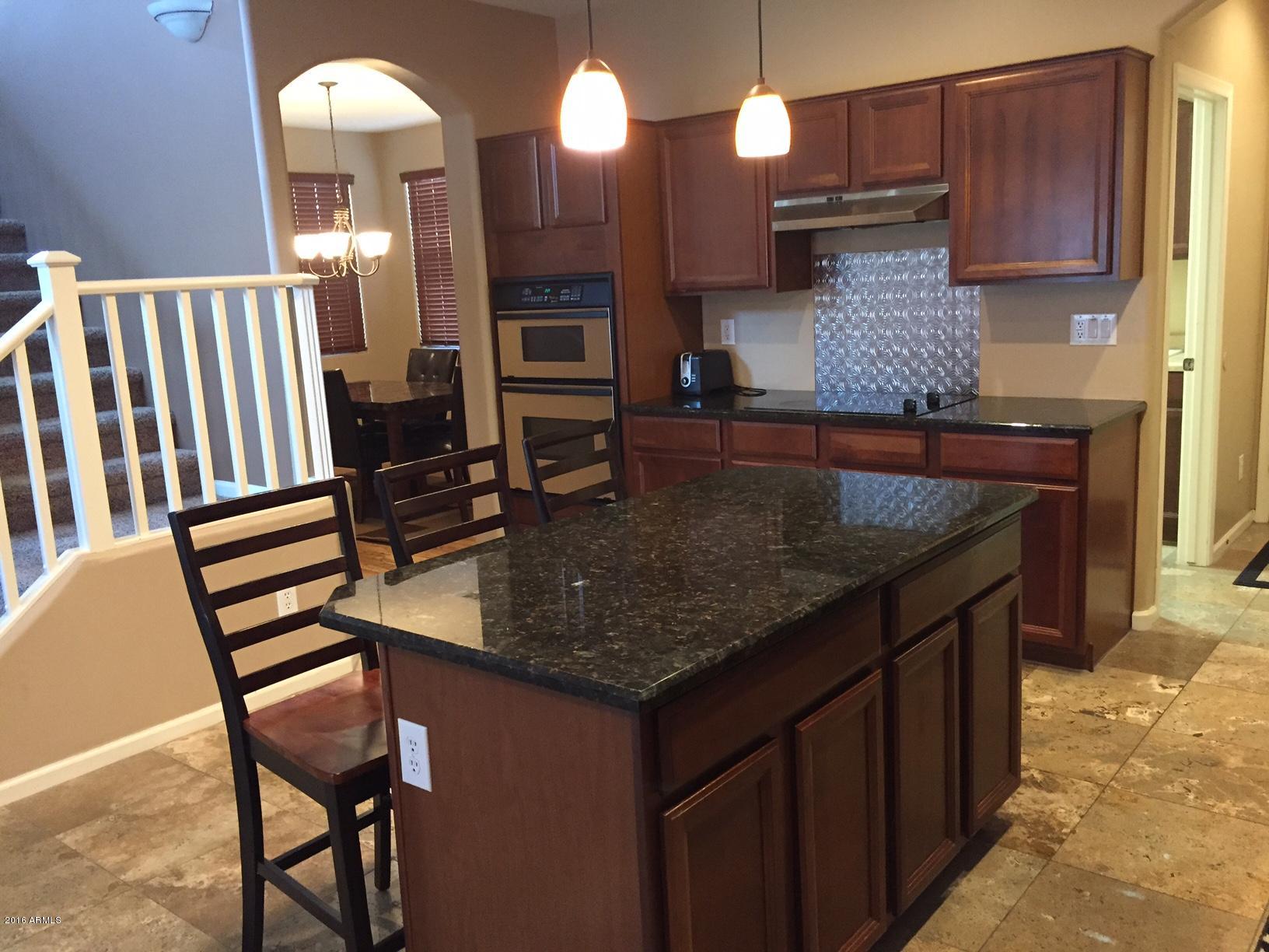 2222 West Roy Rogers Road Phoenix, AZ 85085 - Photo 8 of 37 kitchen looking toward dining room