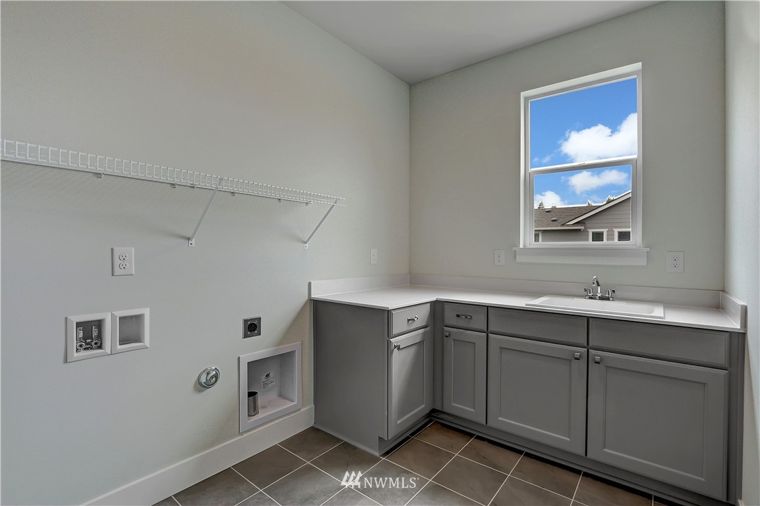 270 Graham Avenue Southeast Renton, WA 98059 - Photo 15 of 17 a view of cabinets a sink and a window