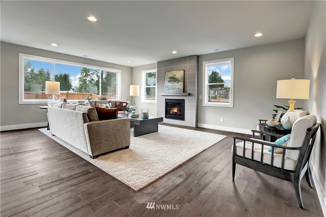 270 Graham Avenue Southeast Renton, WA 98059 - Photo 4 of 17 a living room with furniture fireplace and a large window