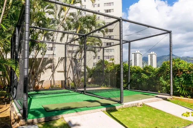 a view of a house with a backyard and a tree