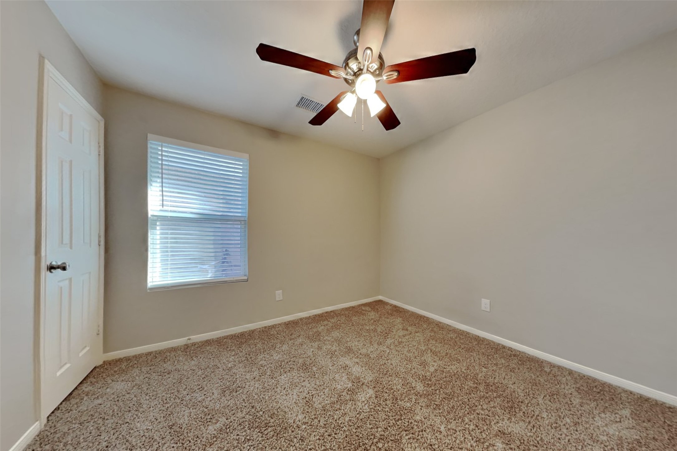 29323 Winton Wood Way Spring, TX 77386 - Photo 14 of 18 an empty room with a window and a fan