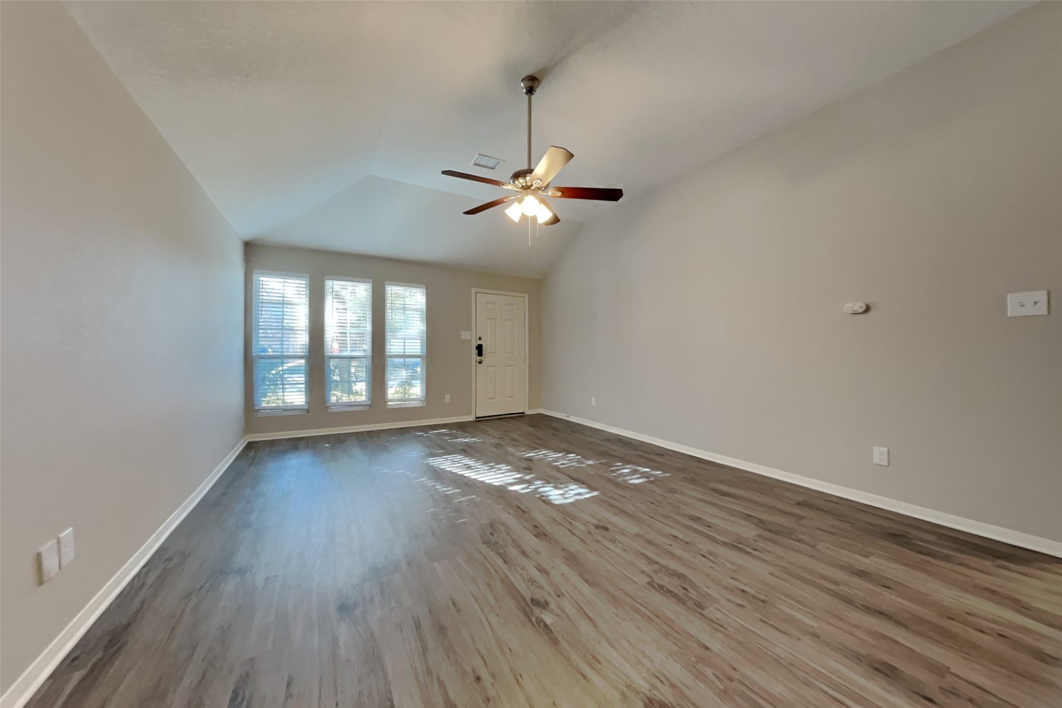 29323 Winton Wood Way Spring, TX 77386 - Photo 2 of 18 wooden floor in an empty room with a window