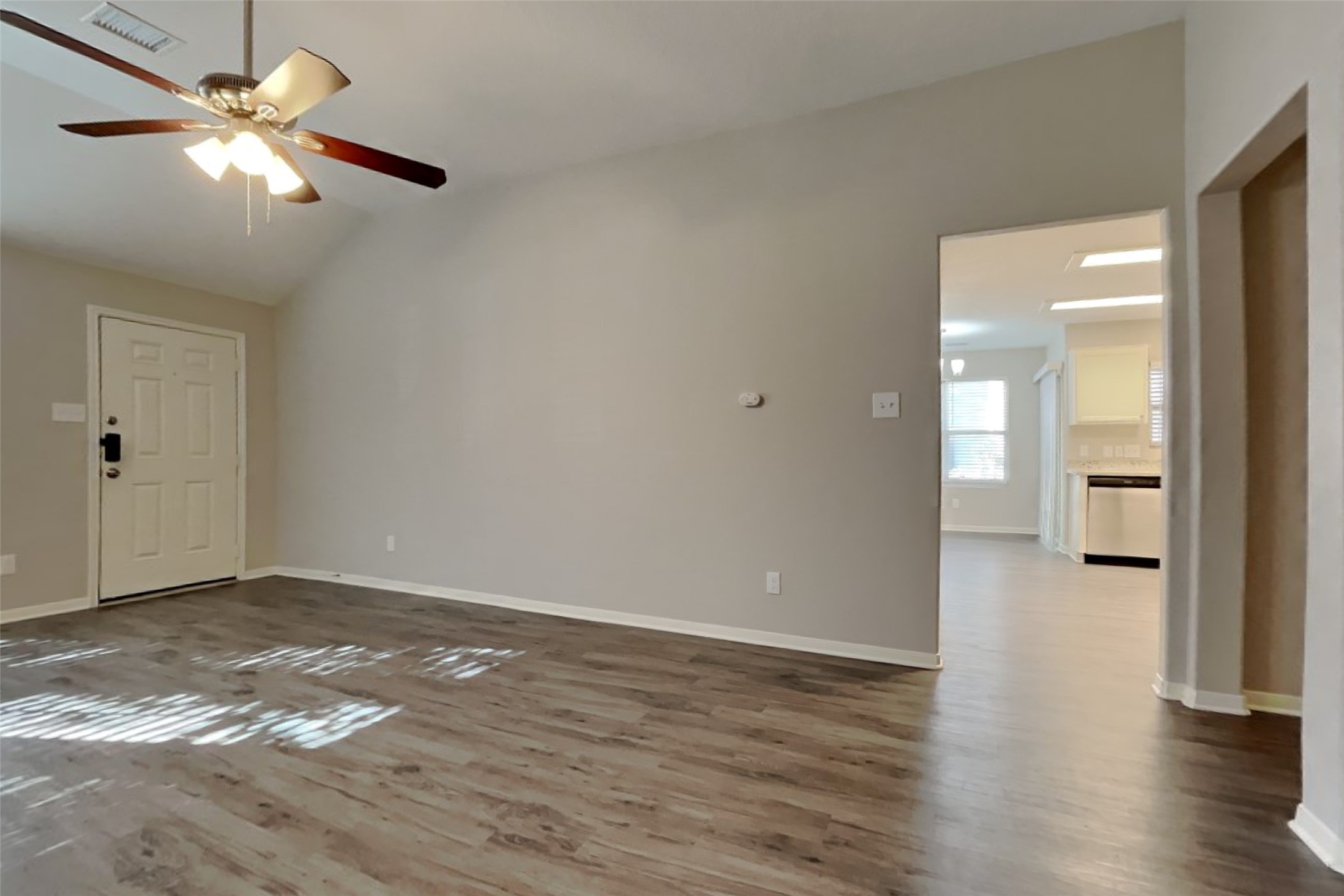 29323 Winton Wood Way Spring, TX 77386 - Photo 4 of 18 an empty room with wooden floor and a ceiling fan