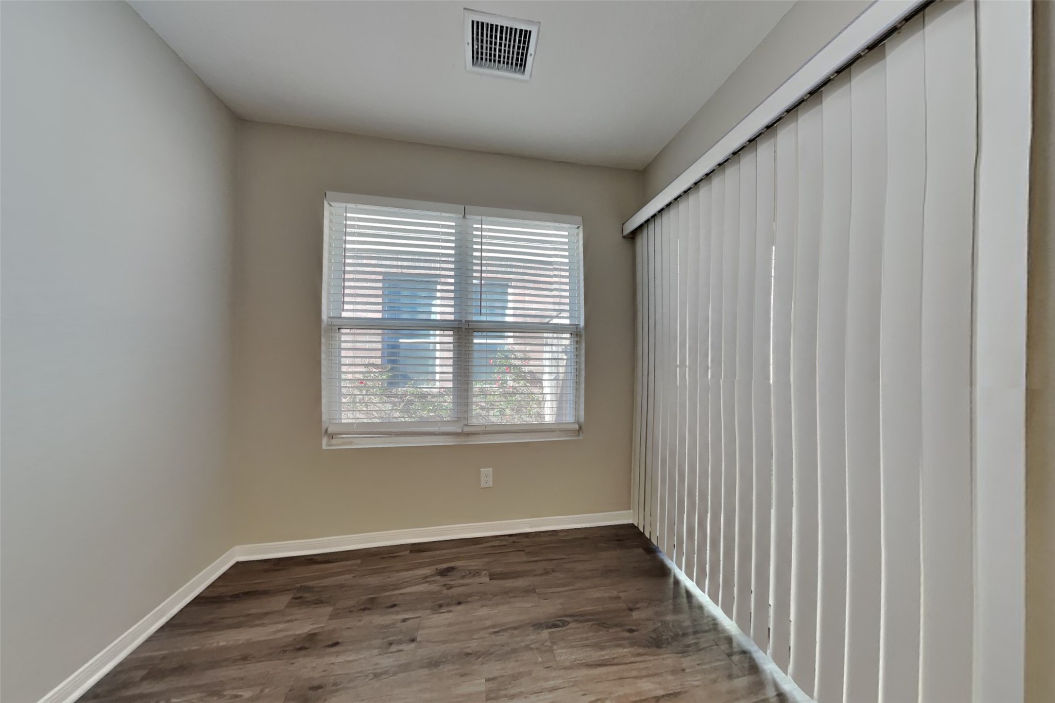 29323 Winton Wood Way Spring, TX 77386 - Photo 7 of 18 a view of an empty room with wooden floor and a window