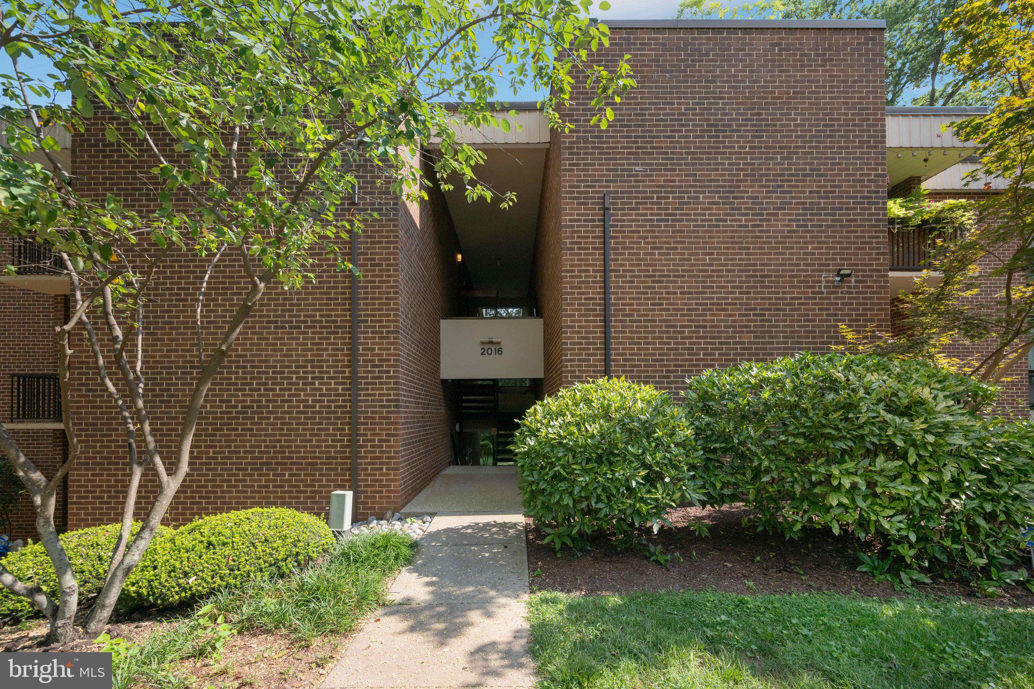 2016 Coleridge Drive, Unit 24102 Silver Spring, MD 20902 - Photo 17 of 19 front view of a house with a yard