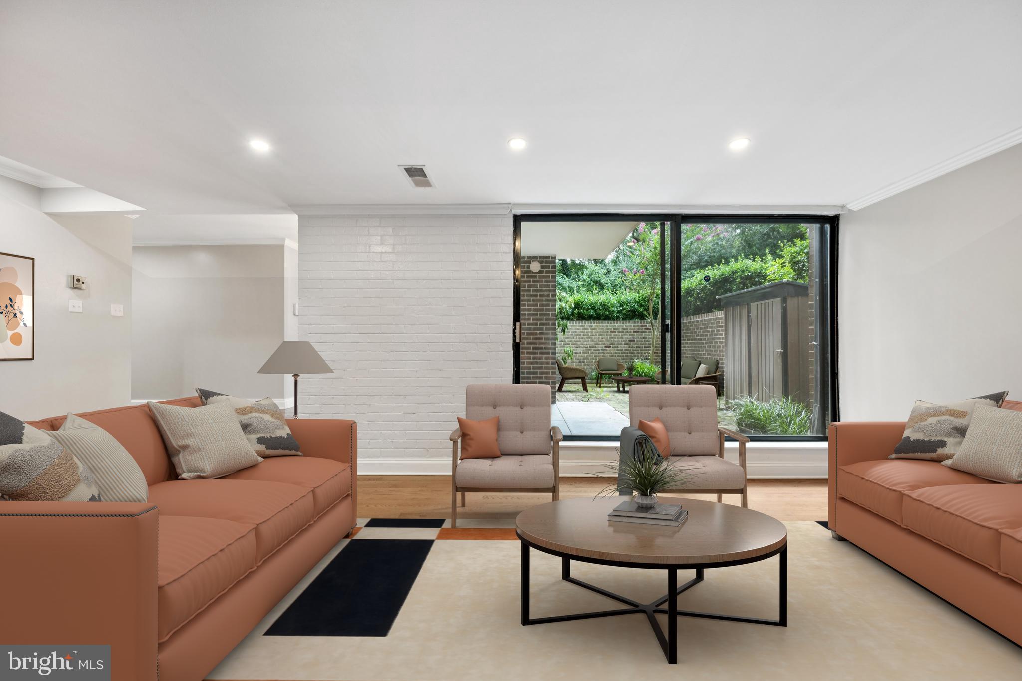 2016 Coleridge Drive, Unit 24102 Silver Spring, MD 20902 - Photo 3 of 19 a living room with furniture and a large window