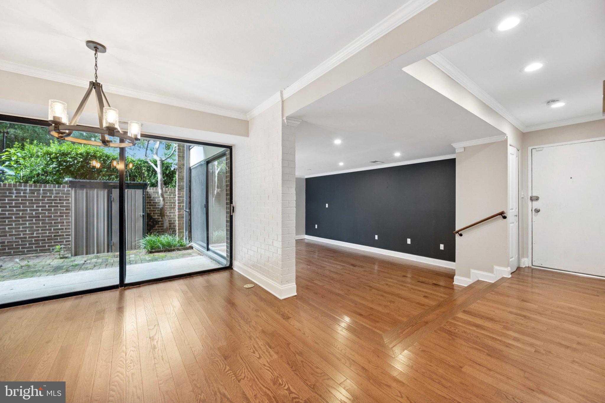 2016 Coleridge Drive, Unit 24102 Silver Spring, MD 20902 - Photo 5 of 19 a view of a room with wooden floor