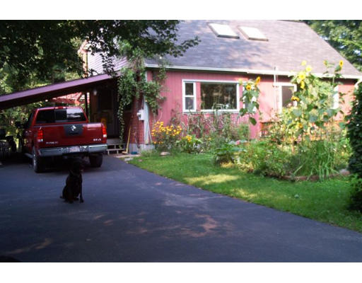 110 Cove Road Lunenburg, MA 01462 - Photo 1 of 25 a view of house with backyard and garden