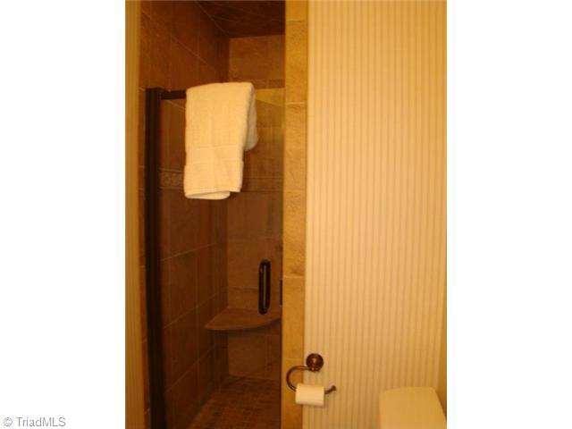 2754 Stutts Road Asheboro, NC 27205 - Photo 14 of 16 Master Bath/Spa. His Bath- Ceramic Tile Shower & Floor