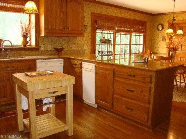 2754 Stutts Road Asheboro, NC 27205 - Photo 4 of 16 Kitchen. Granite Countertops, Hardwood Floors, Eat-At-Bar