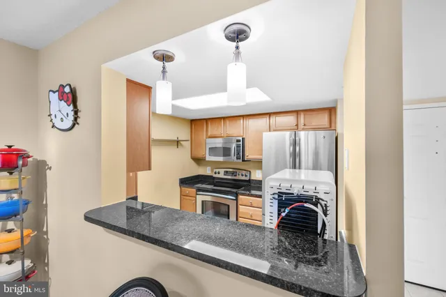 a kitchen with a stove and a refrigerator