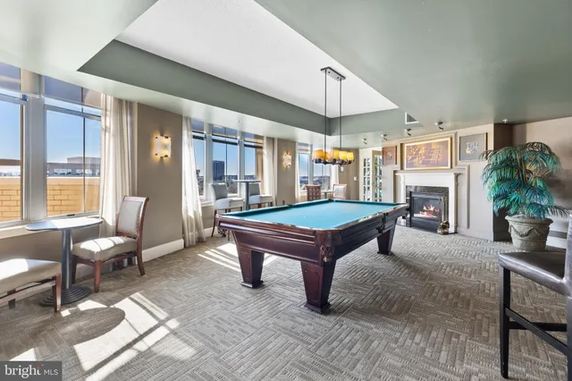 a bedroom with a large bed and a couch