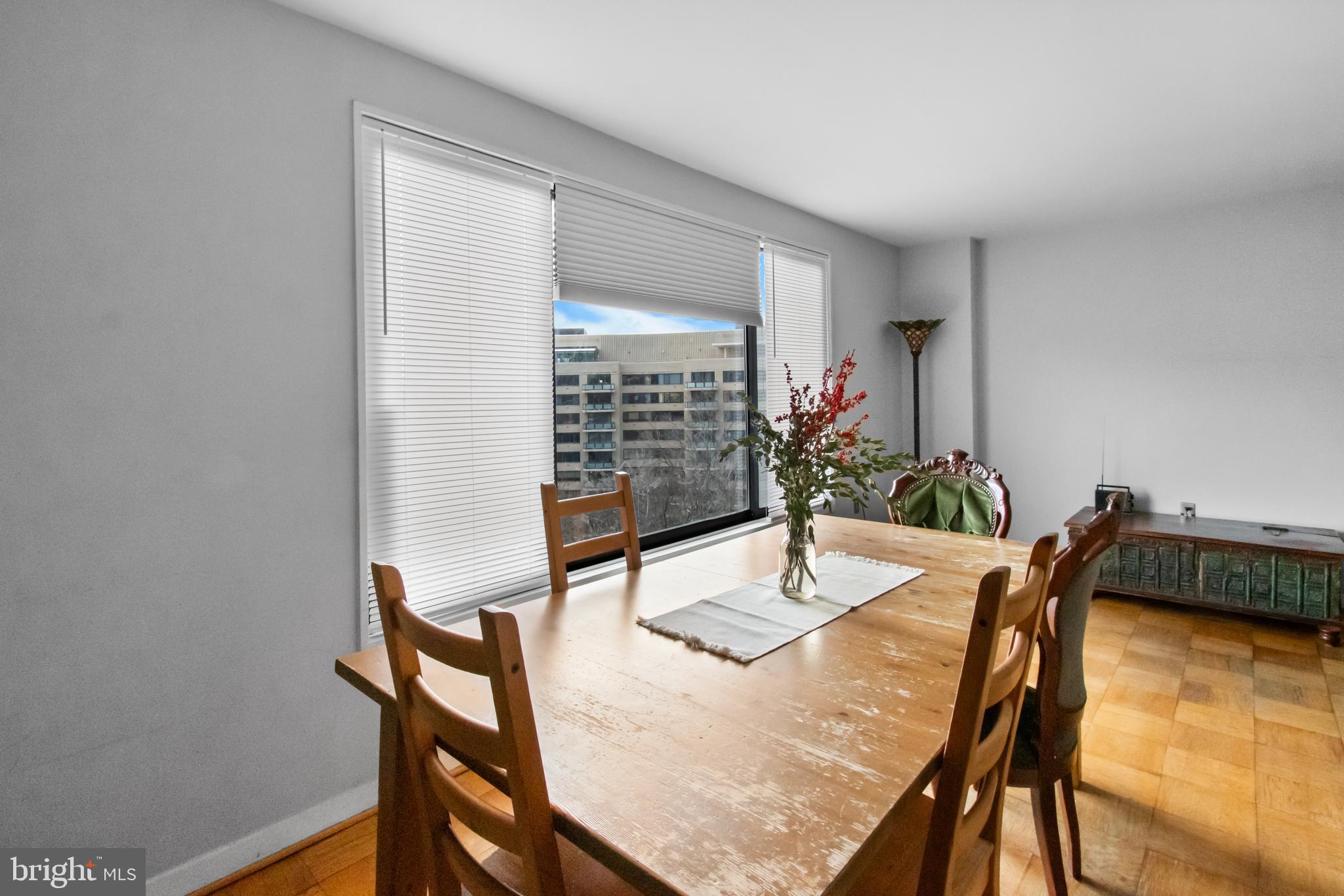 2501 Calvert Street Northwest, Unit 708 Washington, DC 20008 - Photo 12 of 21 a view of a dining room with furniture and wooden floor