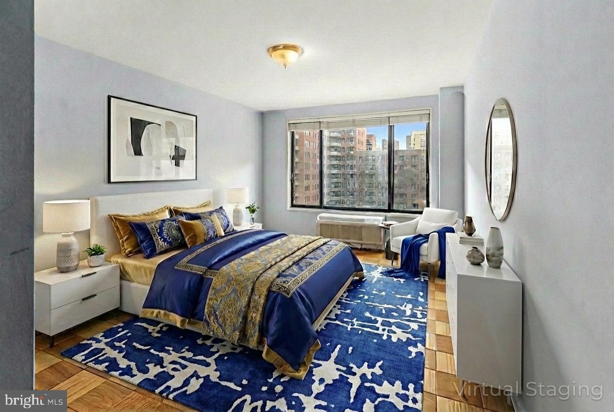 2501 Calvert Street Northwest, Unit 708 Washington, DC 20008 - Photo 18 of 21 a bed room with a bed and a large mirror