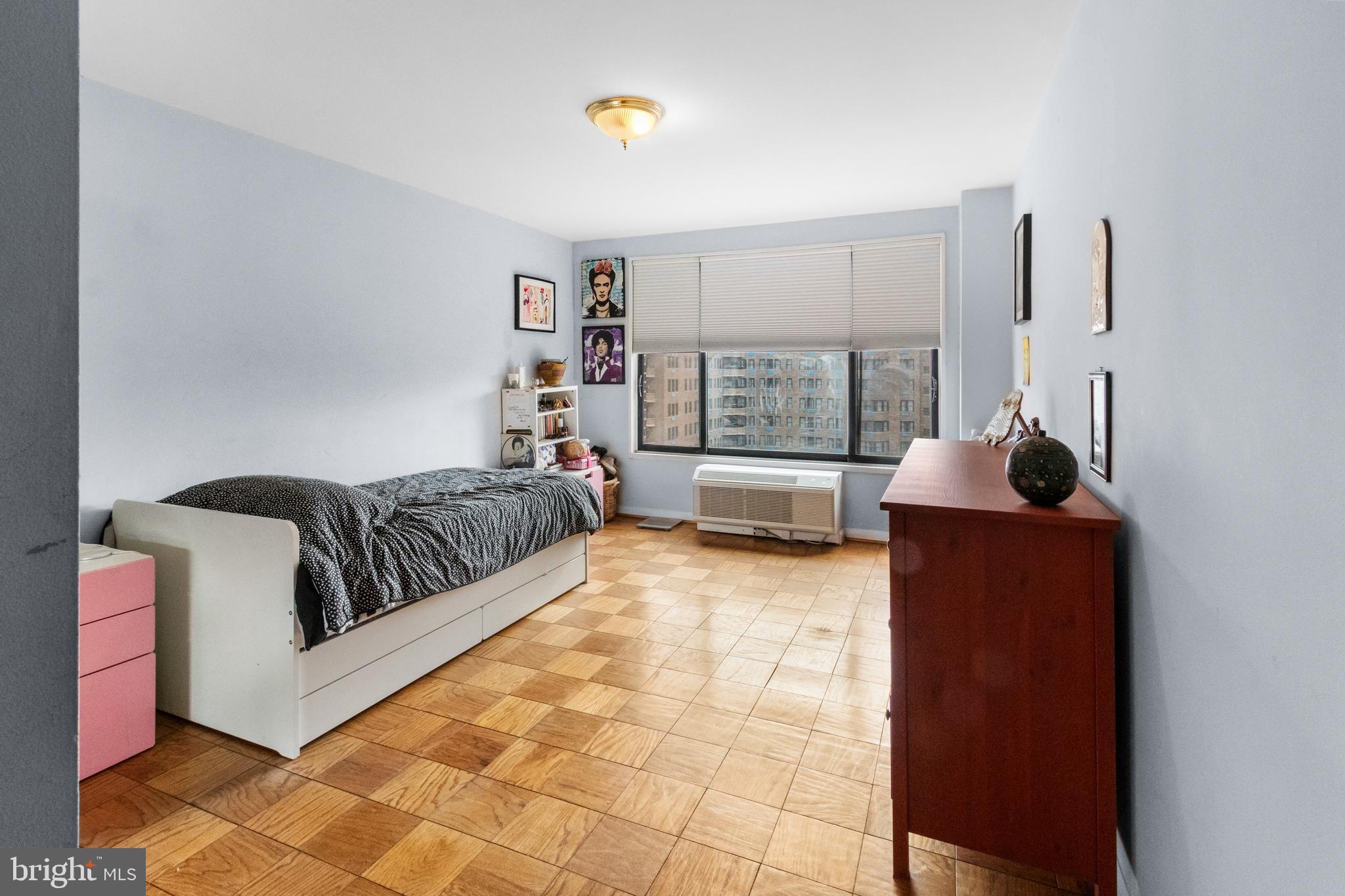 2501 Calvert Street Northwest, Unit 708 Washington, DC 20008 - Photo 19 of 21 a living room with furniture and a window