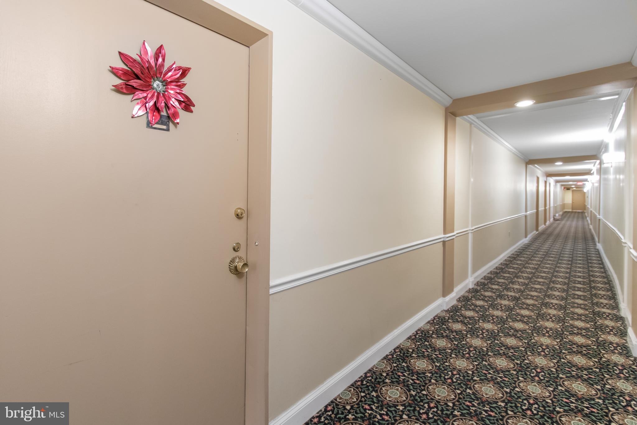 2501 Calvert Street Northwest, Unit 708 Washington, DC 20008 - Photo 7 of 21 a hallway with a view of kitchen
