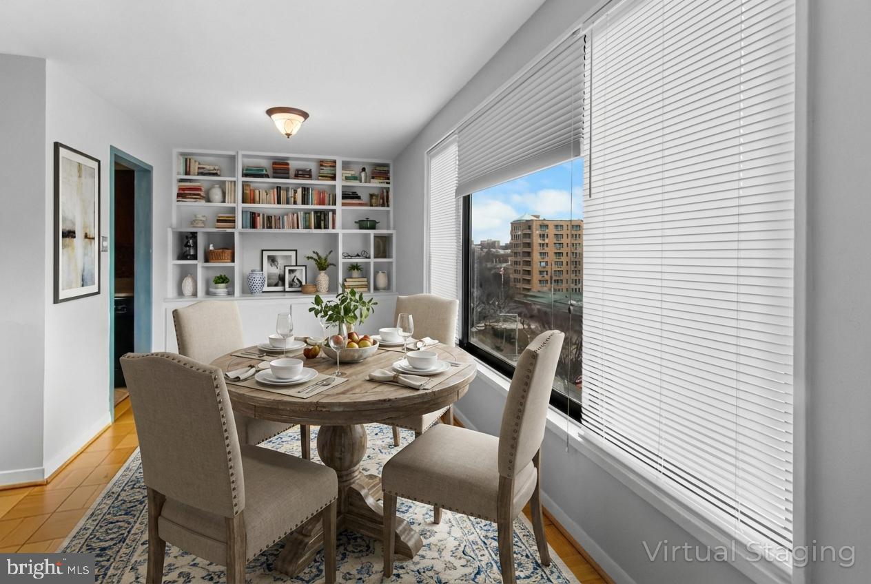 2501 Calvert Street Northwest, Unit 708 Washington, DC 20008 - Photo 9 of 21 a view of a dining room with furniture and window