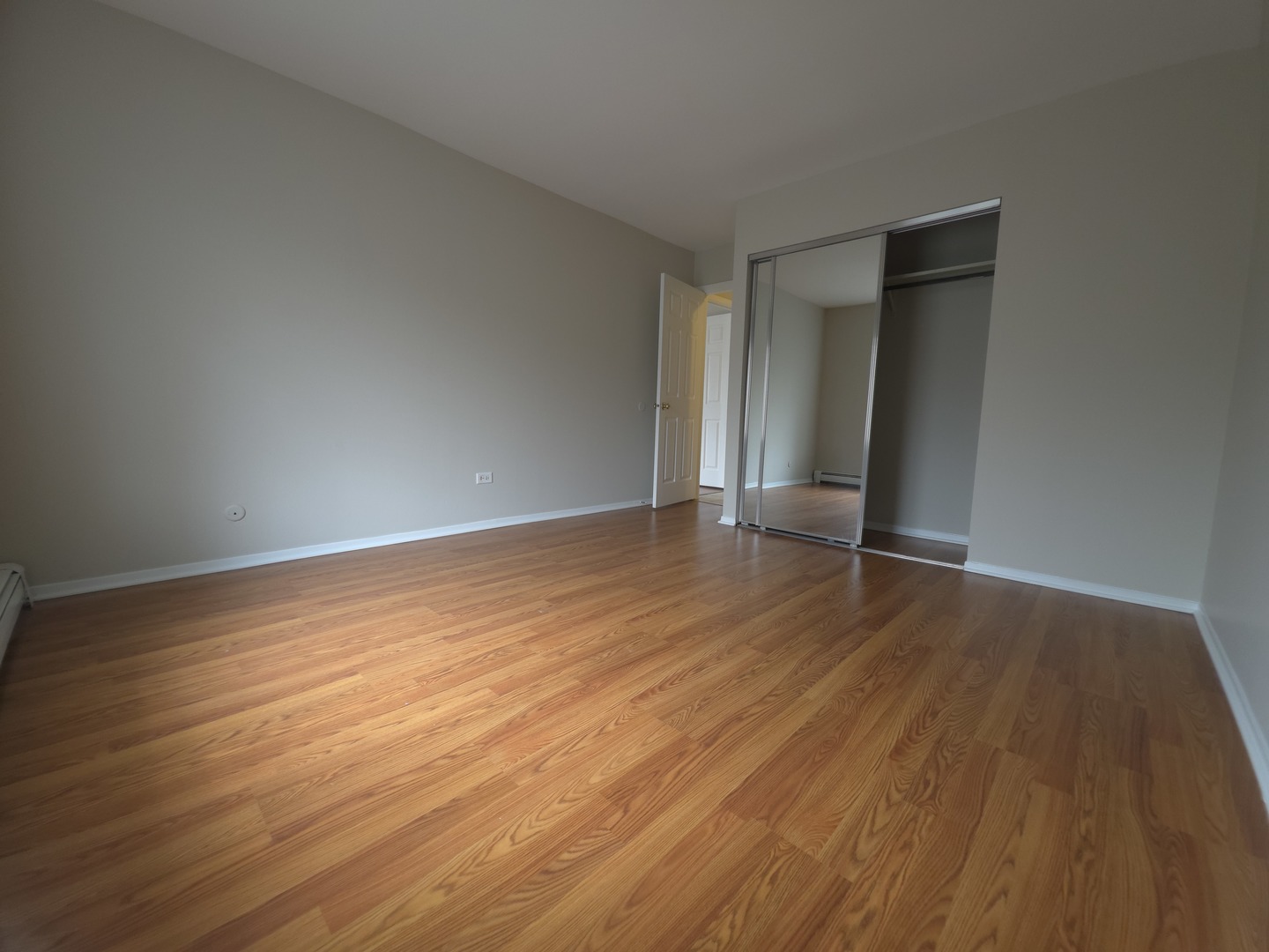 412 East Bailey Road, Unit 101 Naperville, IL 60565 - Photo 11 of 12 a view of an empty room with wooden and a window