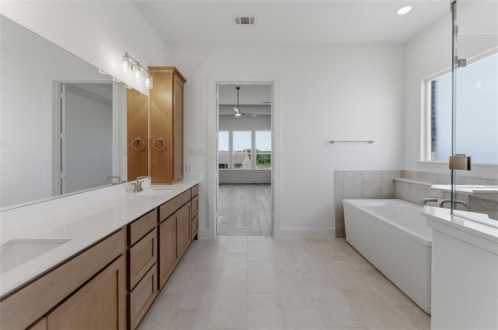 815 Vly Rdg Road Van Alstyne, TX 75495 - Photo 22 of 29 Double vanity with integrated sinks and a light-toned countertop