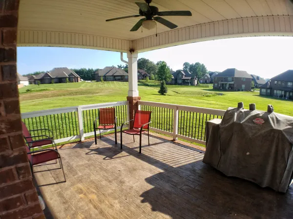a view of a patio with a table chairs and a table