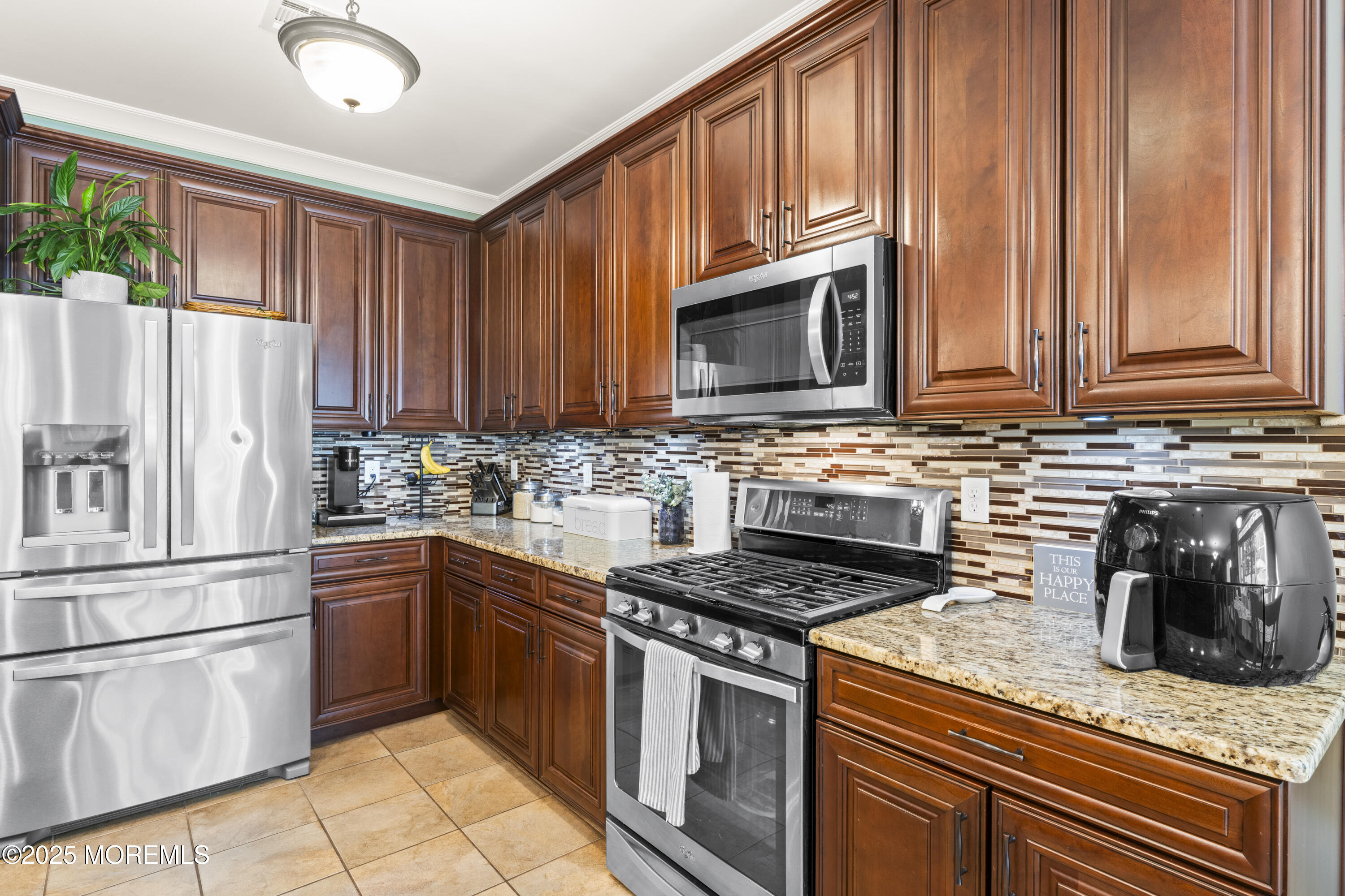 206 Hawthorne Lane Barnegat, NJ 08005 - Photo 12 of 49 a kitchen with granite countertop a refrigerator stove top oven and sink
