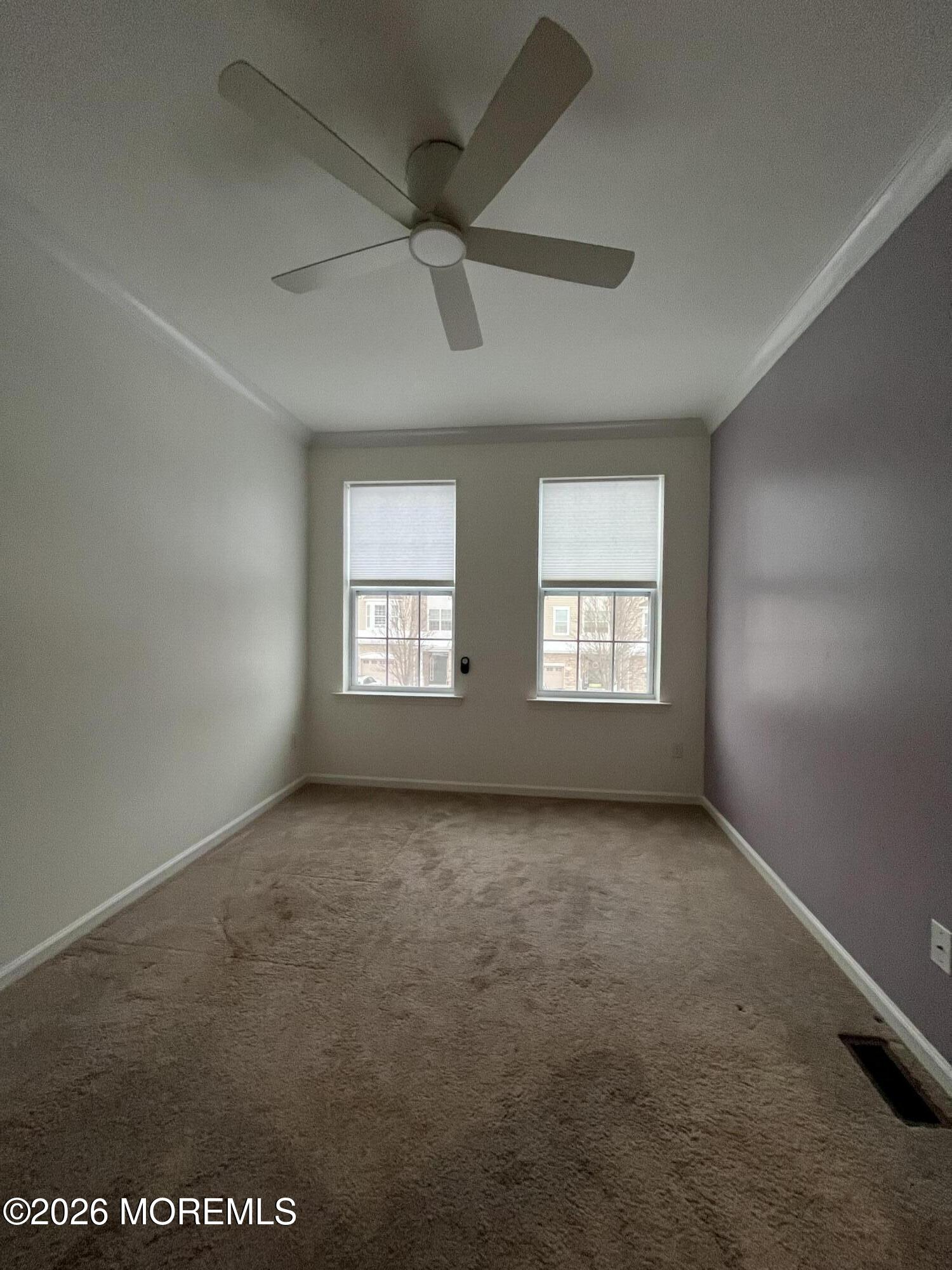 206 Hawthorne Lane Barnegat, NJ 08005 - Photo 19 of 49 an empty room with windows and fan