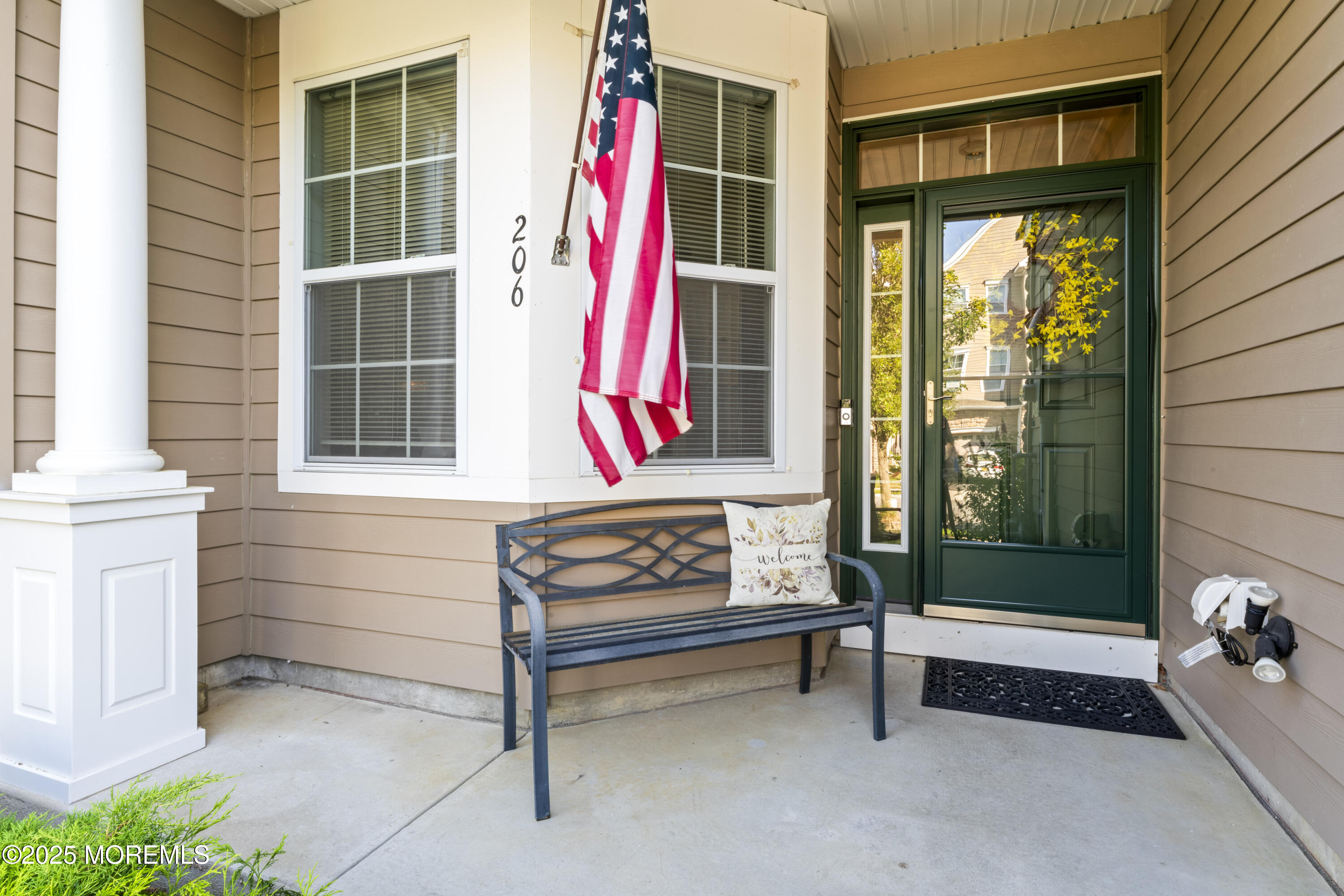 206 Hawthorne Lane Barnegat, NJ 08005 - Photo 2 of 49 a bench sitting in front of a building