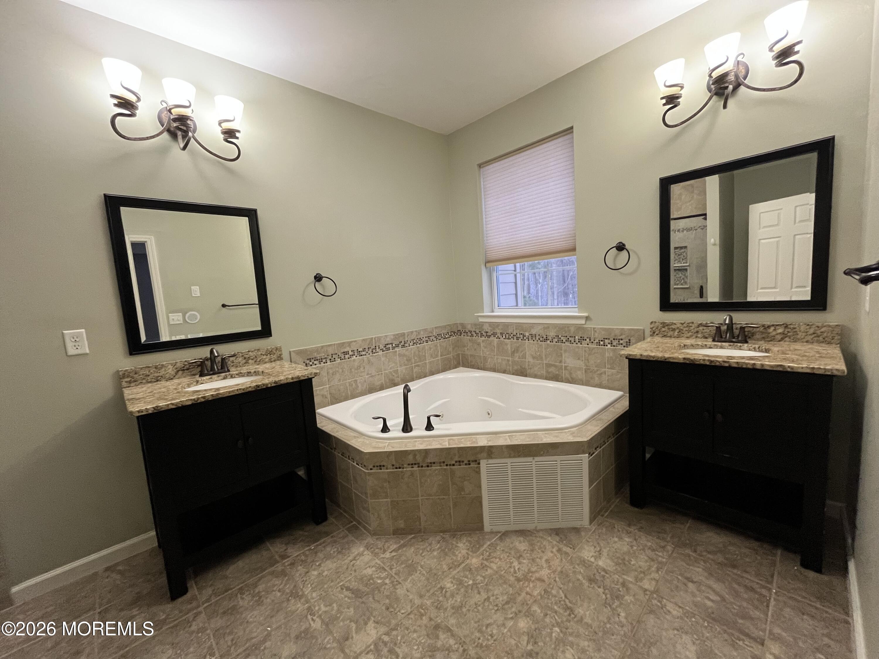 206 Hawthorne Lane Barnegat, NJ 08005 - Photo 28 of 49 a bathroom with a tub sink and mirror