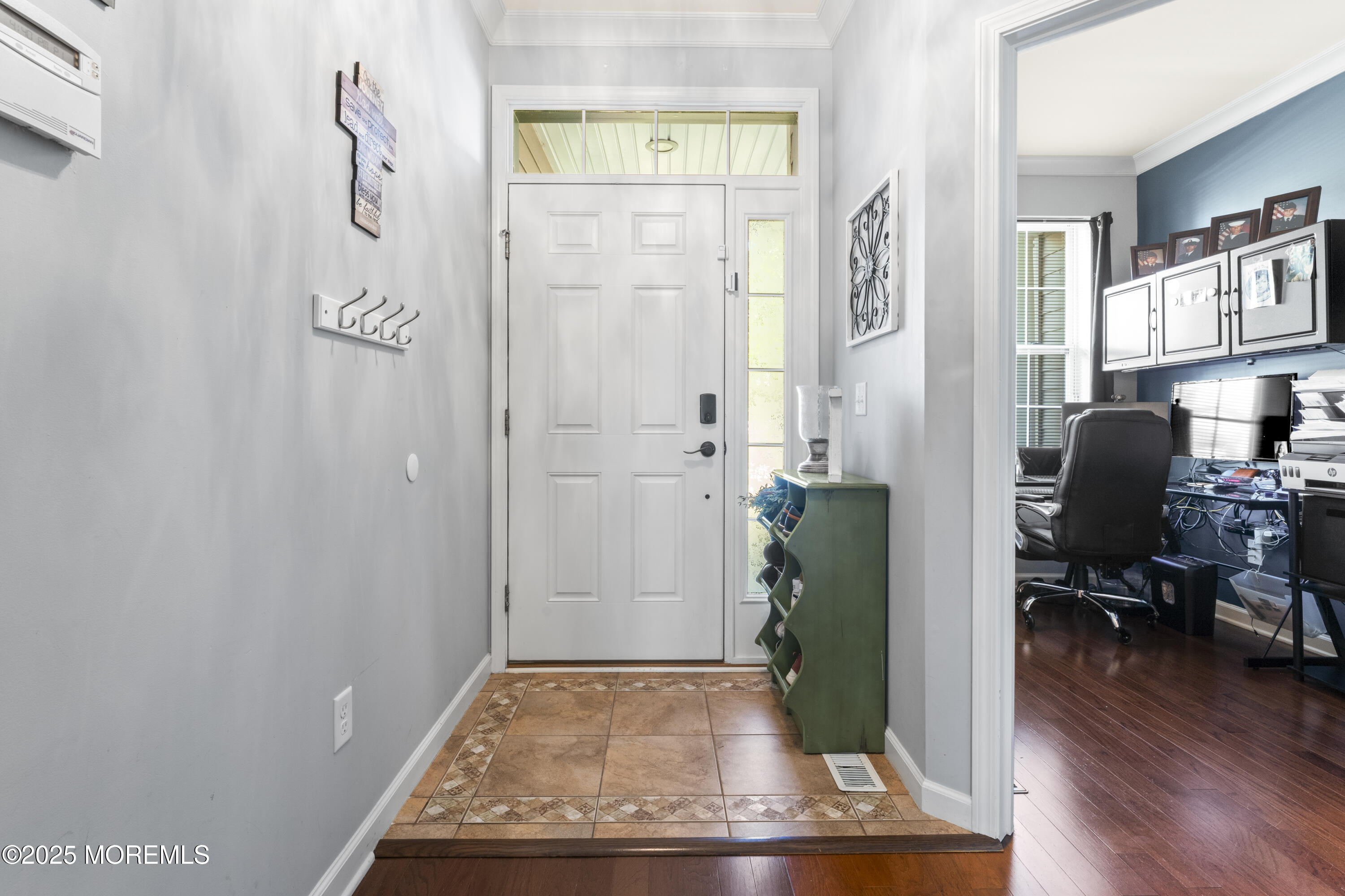 206 Hawthorne Lane Barnegat, NJ 08005 - Photo 3 of 49 a view of a hallway with wooden floor and a living room