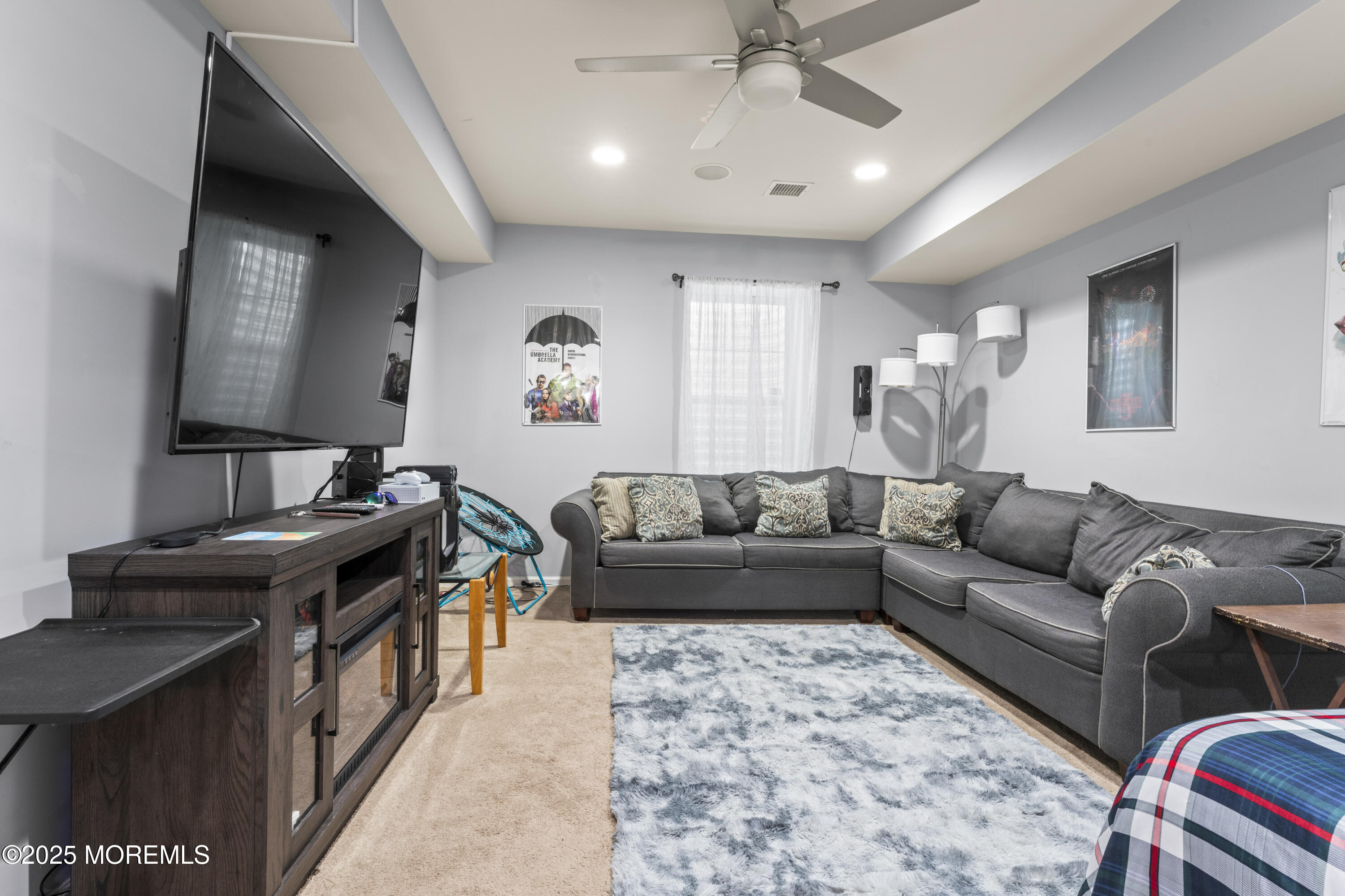 206 Hawthorne Lane Barnegat, NJ 08005 - Photo 32 of 49 a living room with furniture and a flat screen tv