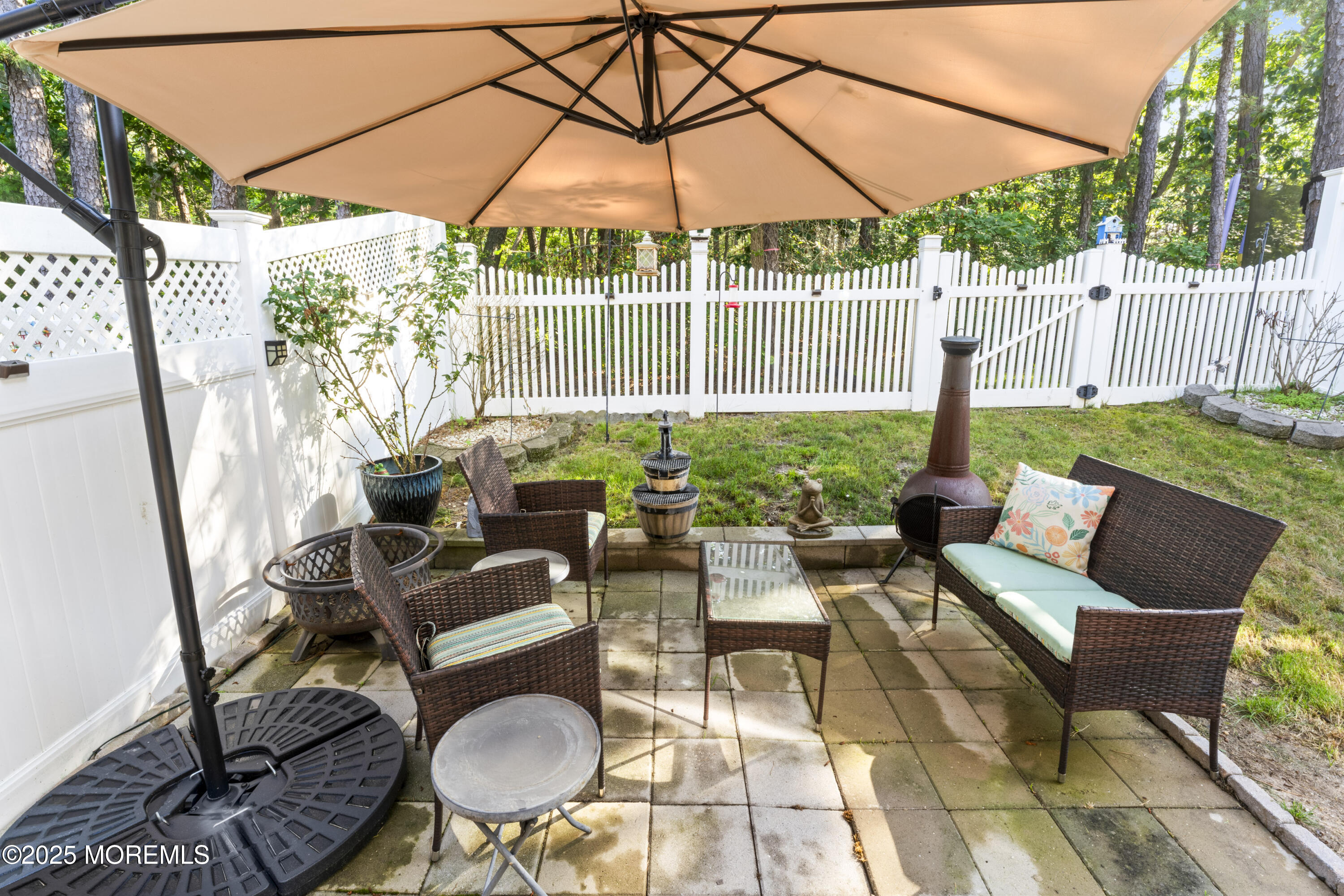 206 Hawthorne Lane Barnegat, NJ 08005 - Photo 35 of 49 a building outdoor space with patio couches and potted plants