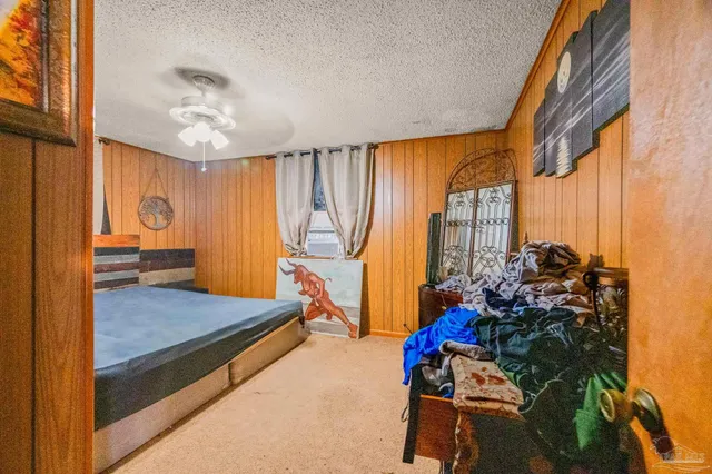 a very nice looking room with a large window and a chandelier