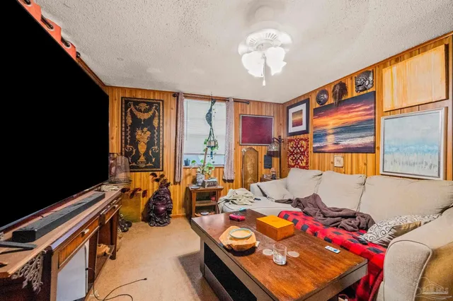 a room with furniture and a flat screen tv