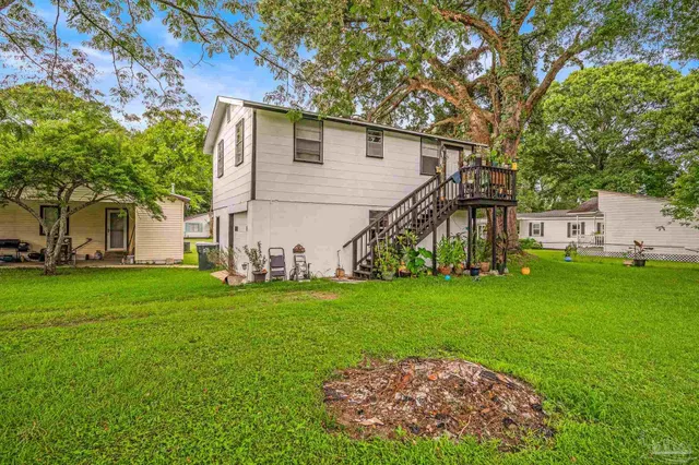a view of a park with large trees