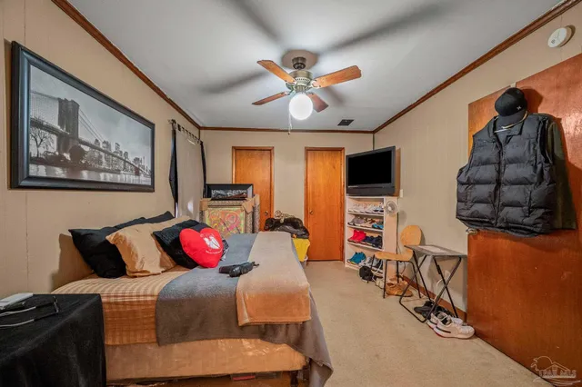 a bedroom with a bed and glass wall painting