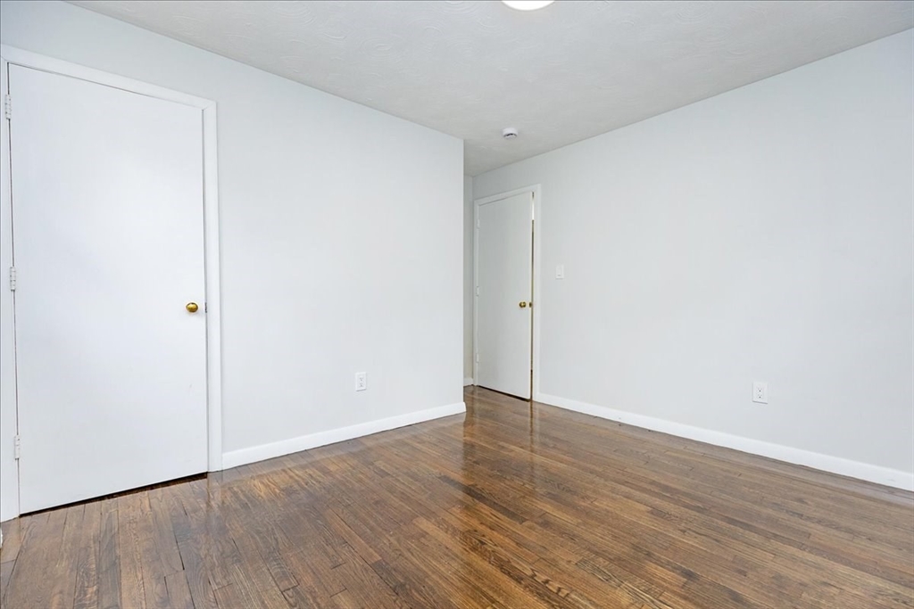38 Warren Street Revere, MA 02151 - Photo 16 of 42 a view of an empty room with wooden floor