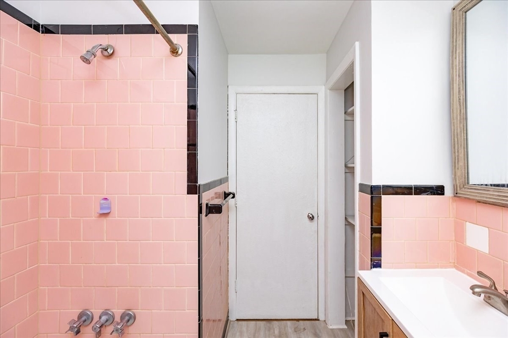 38 Warren Street Revere, MA 02151 - Photo 18 of 42 a bathroom with a sink mirror and shower
