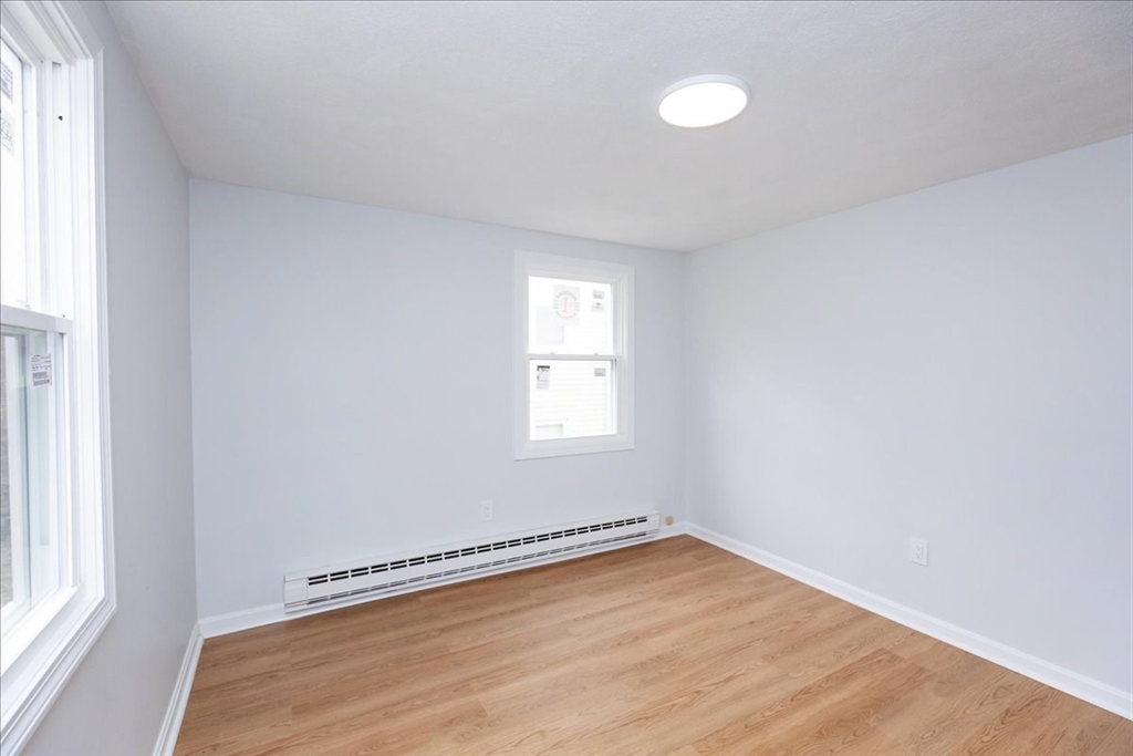 38 Warren Street Revere, MA 02151 - Photo 24 of 42 a view of a room with wooden floor and window