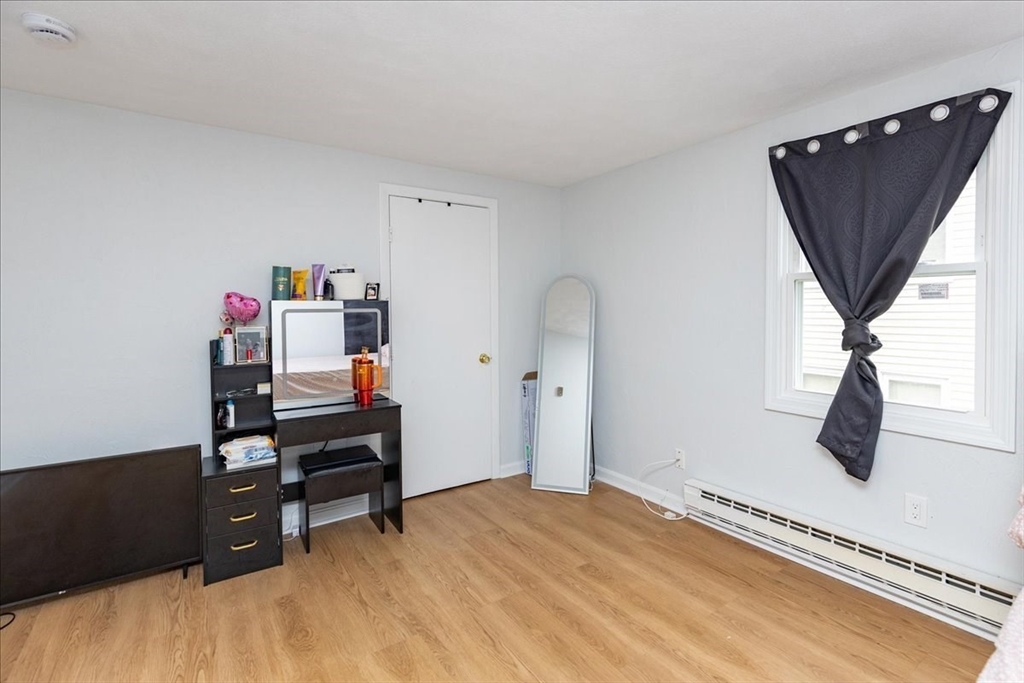 38 Warren Street Revere, MA 02151 - Photo 29 of 42 a bedroom with a bed and a window