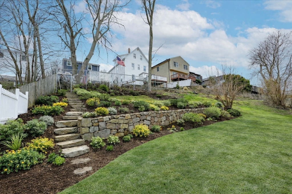 38 Warren Street Revere, MA 02151 - Photo 3 of 42 a front view of house with a garden