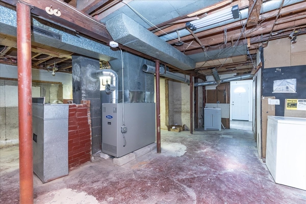38 Warren Street Revere, MA 02151 - Photo 36 of 42 a view of a hallway with wooden walls