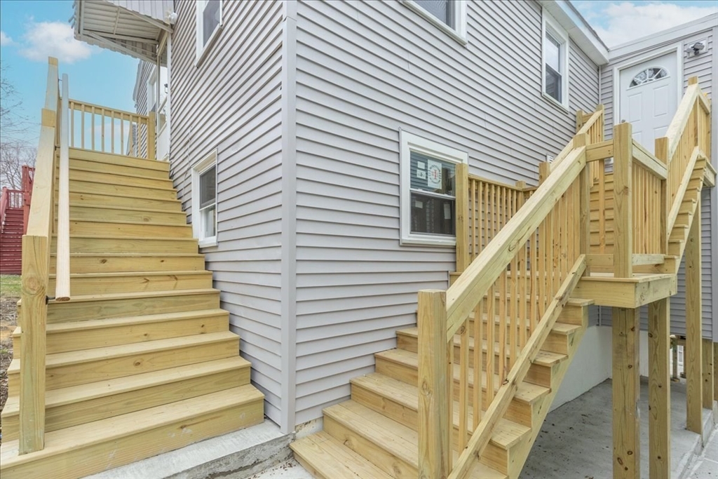 38 Warren Street Revere, MA 02151 - Photo 41 of 42 a view of entryway with wooden floor and stairs