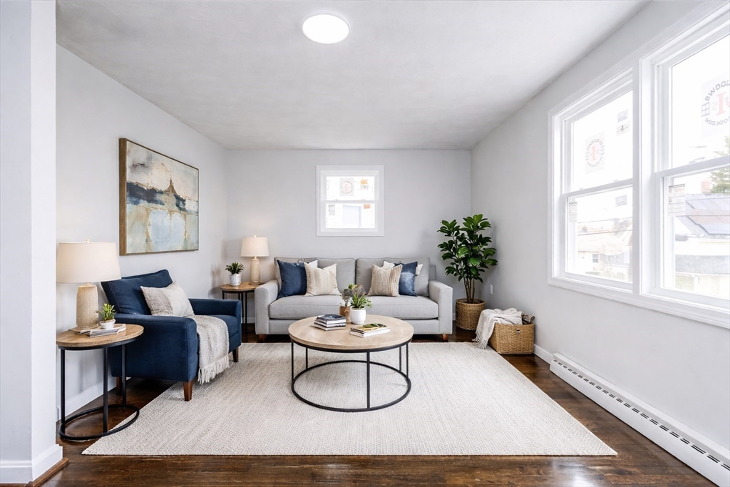 38 Warren Street Revere, MA 02151 - Photo 6 of 42 a living room with furniture a window and a potted plant
